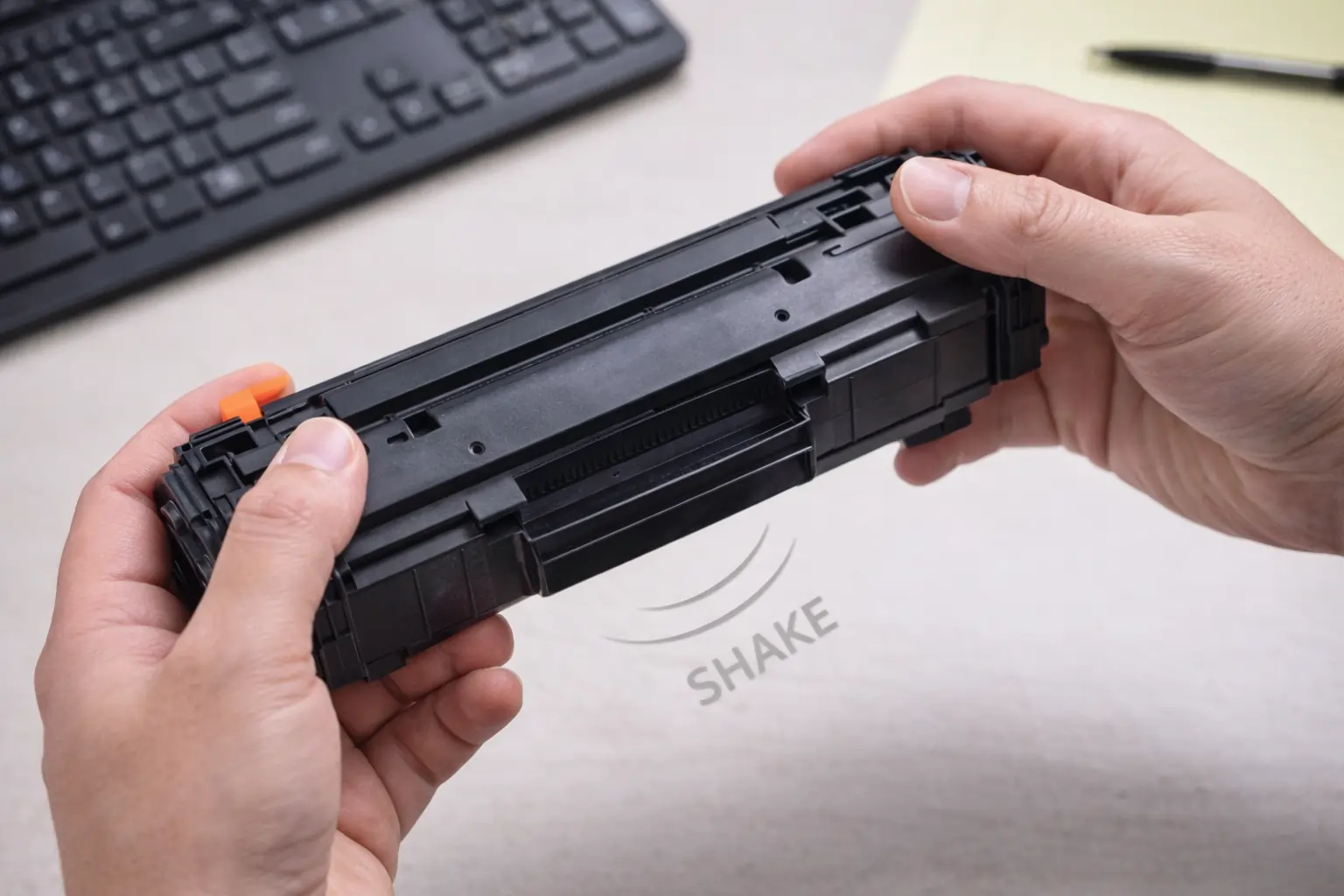 shaking toner cartridge to check if toner cartridges are empty